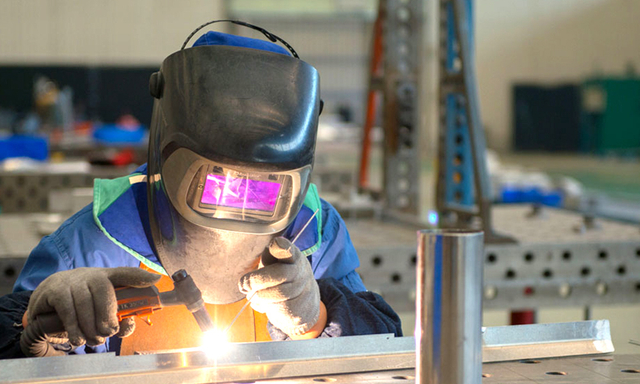Certified aluminum welding specialist performing high-precision fabrication at Abelly workshop